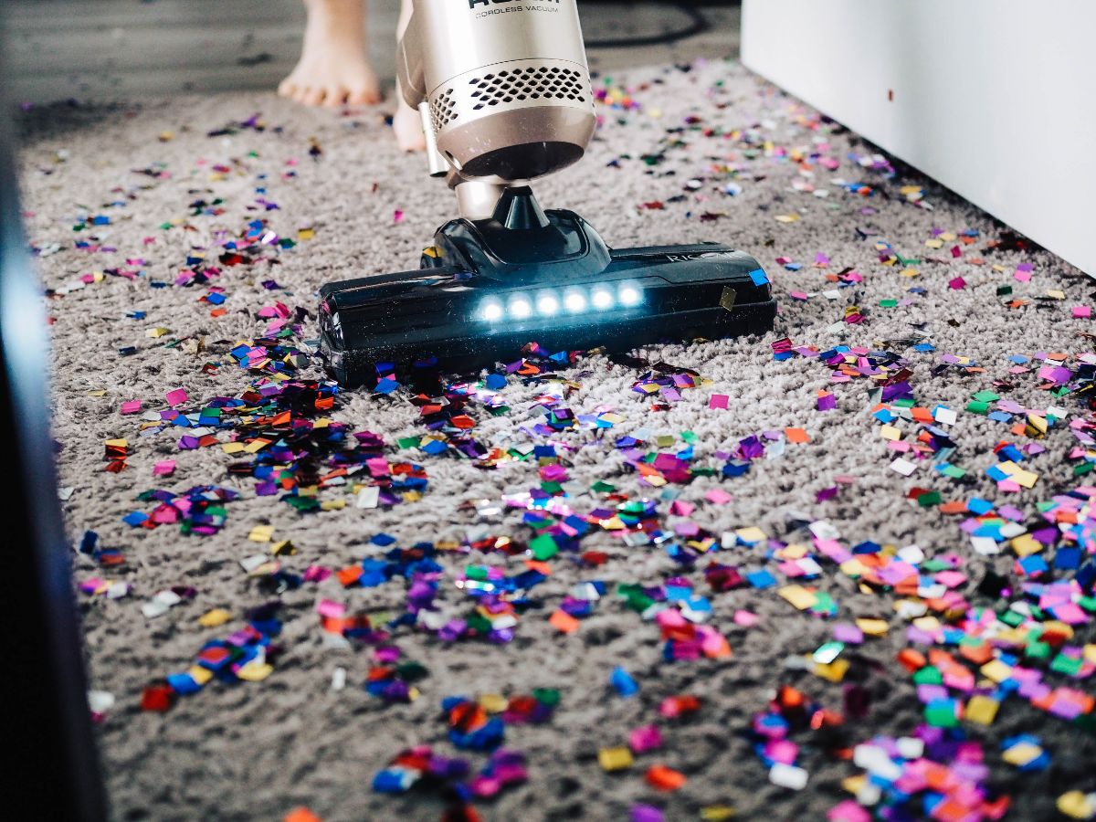 Confetti on a carpet being vacuumed