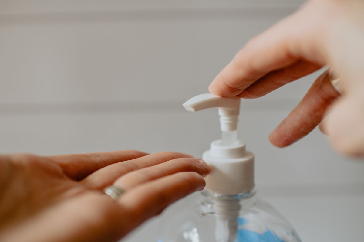 Hands and hand sanitizer pump
